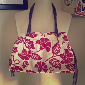 Red and beige fabric with leather shoulder bag.